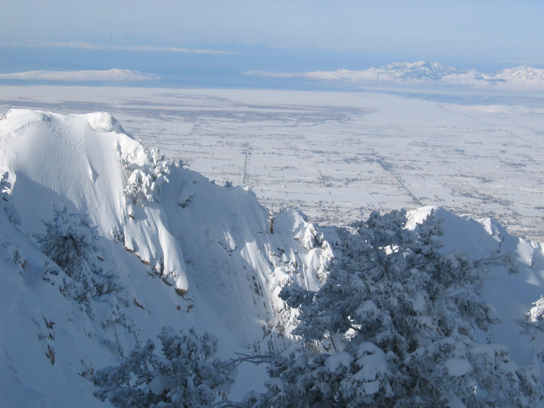 Snow-covered ridgeline above a valley