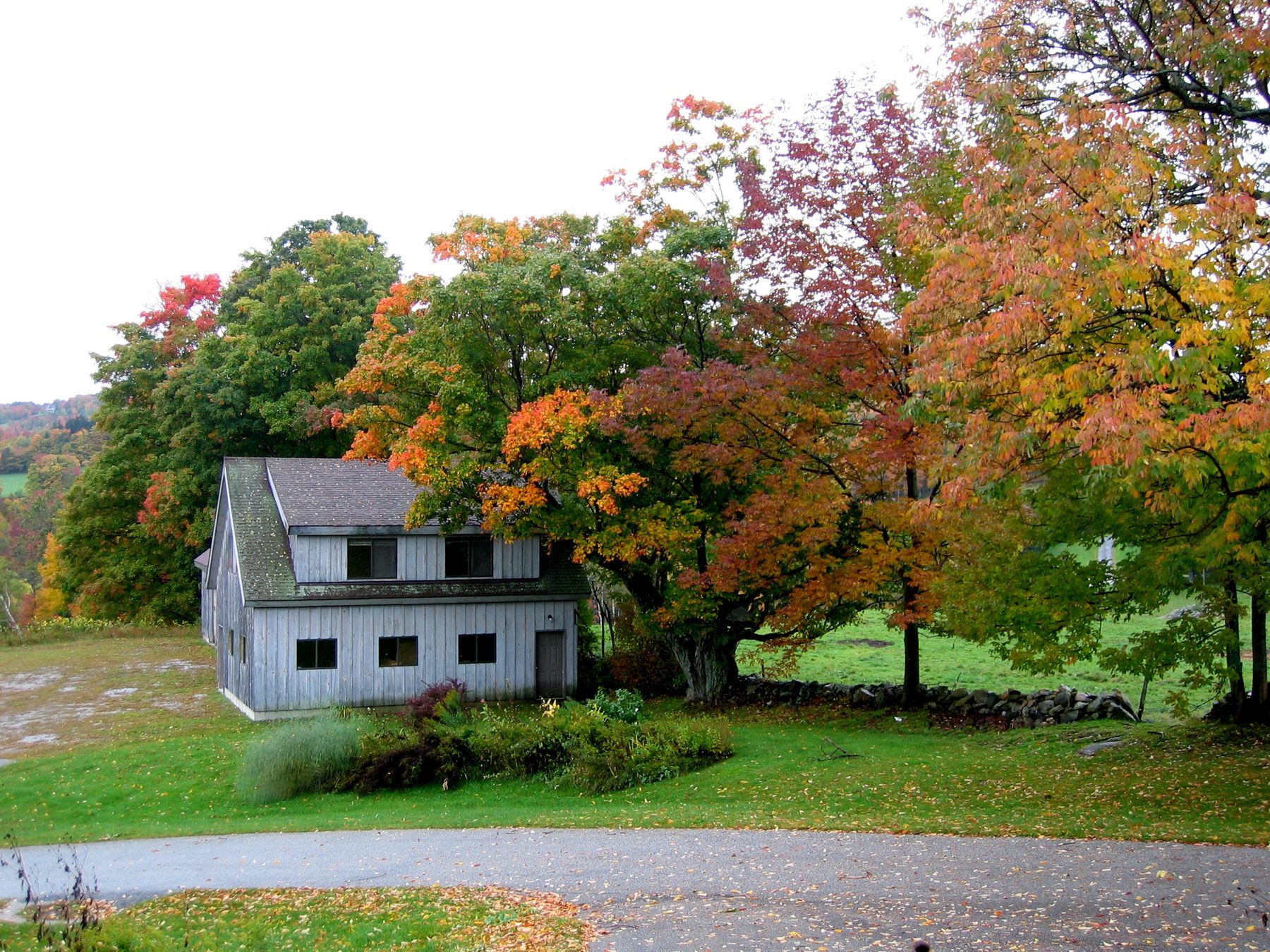 Vermont farmhouse in fall foliage